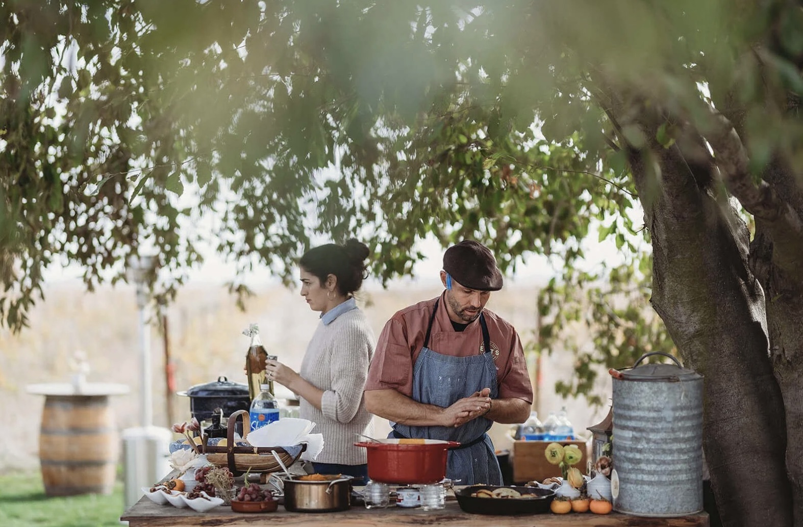 Chef Tommy cooking at an outdoor event prep table